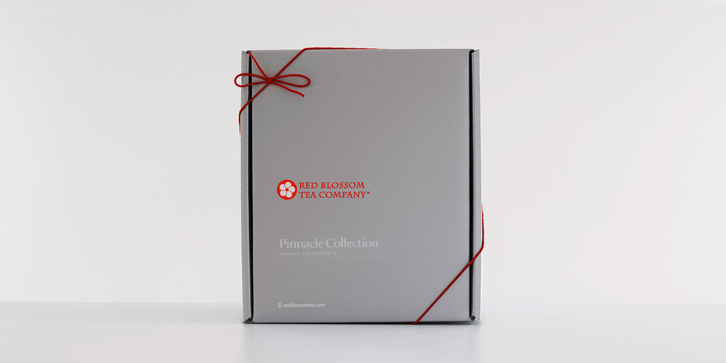 An unopened silver box with a label reading “Pinnacle Collection”