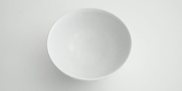 View of the inside of a white stoneware bowl crafted by Xu De Jia.