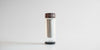 The fully assembled small thermos, without the cozy. The strainer is locked onto a lip inside the glass thermos, and has space for tea leaves either inside the strainer or underneath it.