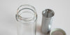 Close up of the lip of the glass thermos, threaded to match with the lid. It's double-walled to insulate heat and has a small lip for the strainer basket to snap onto.