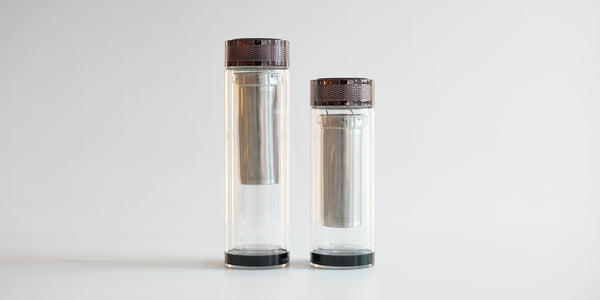 Two fully assembled thermoses side by side. The one on the left is larger, the one on the right is slightly shorter.
