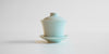 Side view of a blue-green celadon gaiwan.