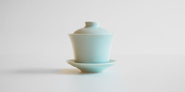 Side view of a blue-green celadon gaiwan.