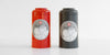 Two canisters, one red one gray, each with a Red Blossom Tea Company label.