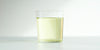 A glass cup filled with brewed osmanthus flower tea.