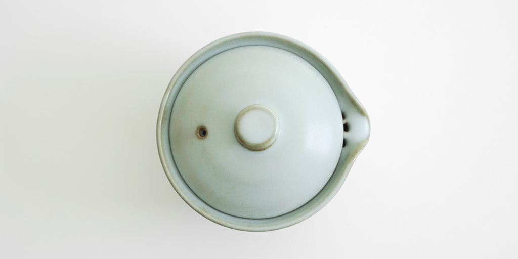 Top down view of the closed shiboridashi, showing the hole in the lid to allow air through and smoother pouring.
