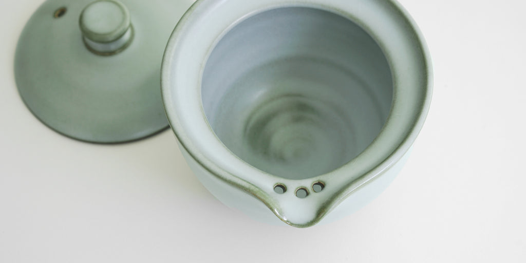 Close up of the shiboridashi's built-in strainer, made up of three holes punched into the clay near the spout.