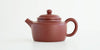 Side view of a terracotta-colored yixing pot, highlighting the rectangular shape.