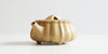 Front view of a terracotta-colored yixing pot highlighting the hexagonal spout.
