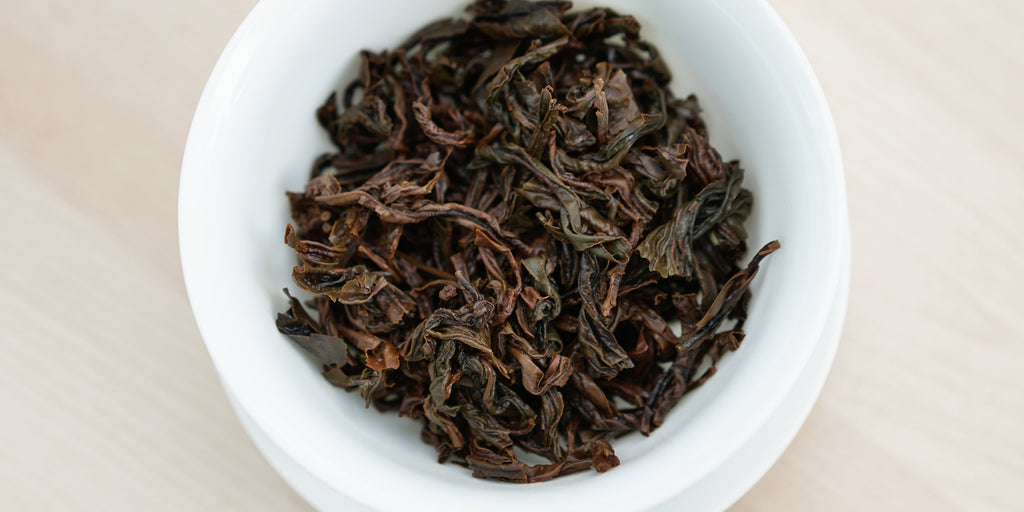 A top-down photo of brewed black tea leaves in a gaiwan.