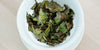 A top-down photo of brewed white tea leaves in a gaiwan.
