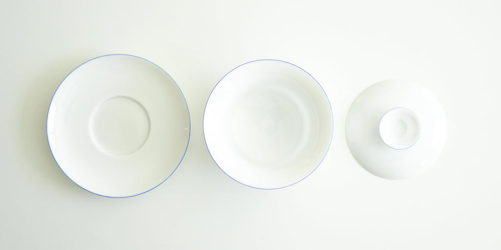 The tops of all the pieces for the gaiwan. From left to right, the plate, the bowl, and the lid