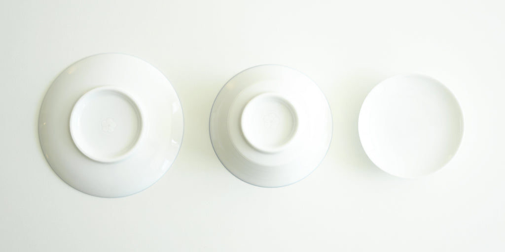 The bottoms of all the pieces for the gaiwan. From left to right, the plate, the bowl, and the lid