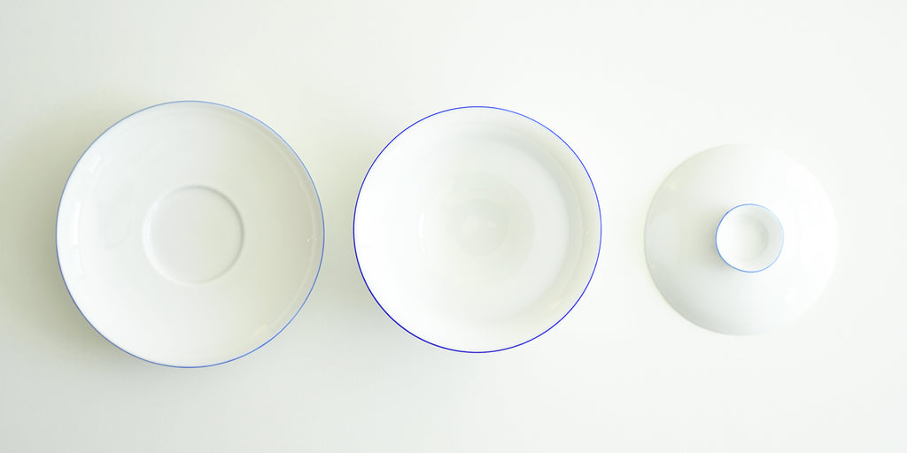 The tops of all the pieces for the gaiwan. From left to right, the plate, the bowl, and the lid