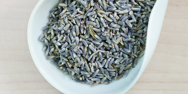 A white dish containing dry lavender.