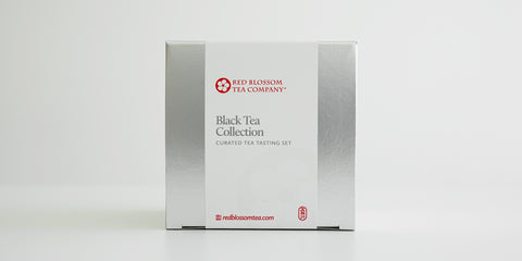 A silver box with a white label reading “Black Tea Collection”