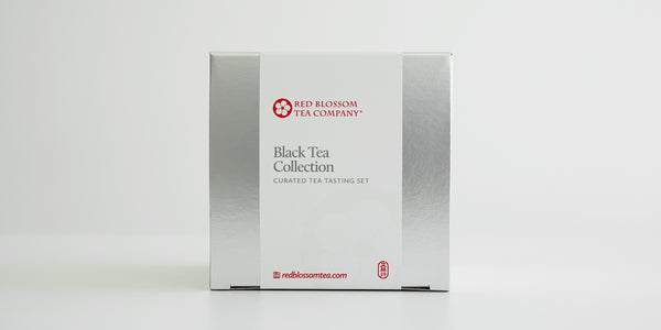 A silver box with a white label reading “Black Tea Collection”