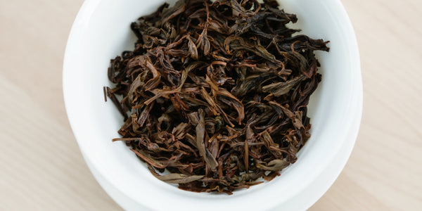 A top-down photo of brewed black tea leaves in a gaiwan.